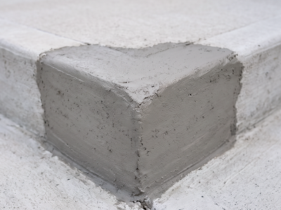 Concrete edge with a smoothed repair