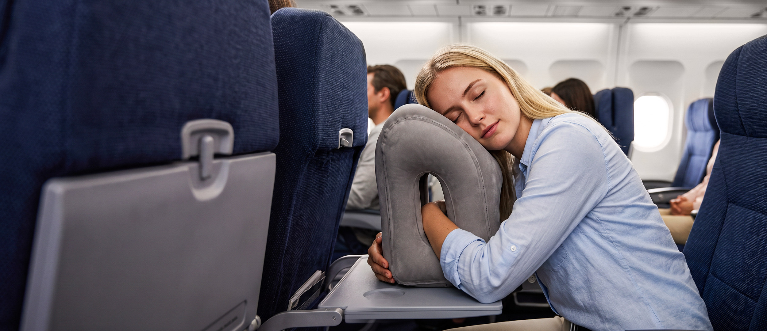 Inflatable travel pillow used while resting in an airplane seat